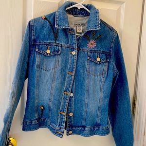 Jean jacket with embroidery on front and back.